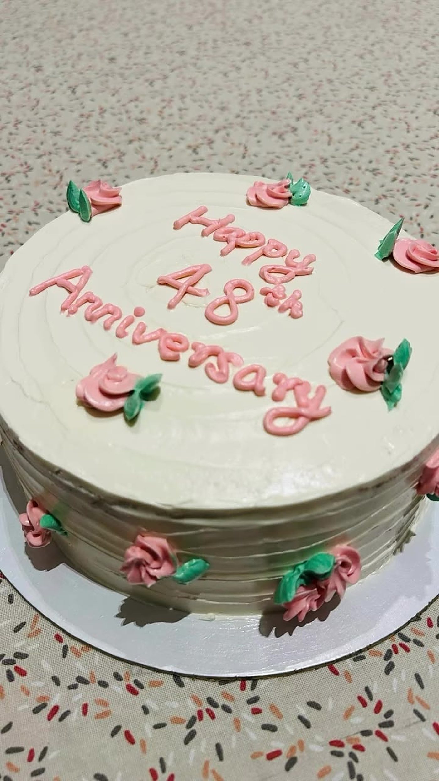 Pink 48th anniversary cake with piped roses