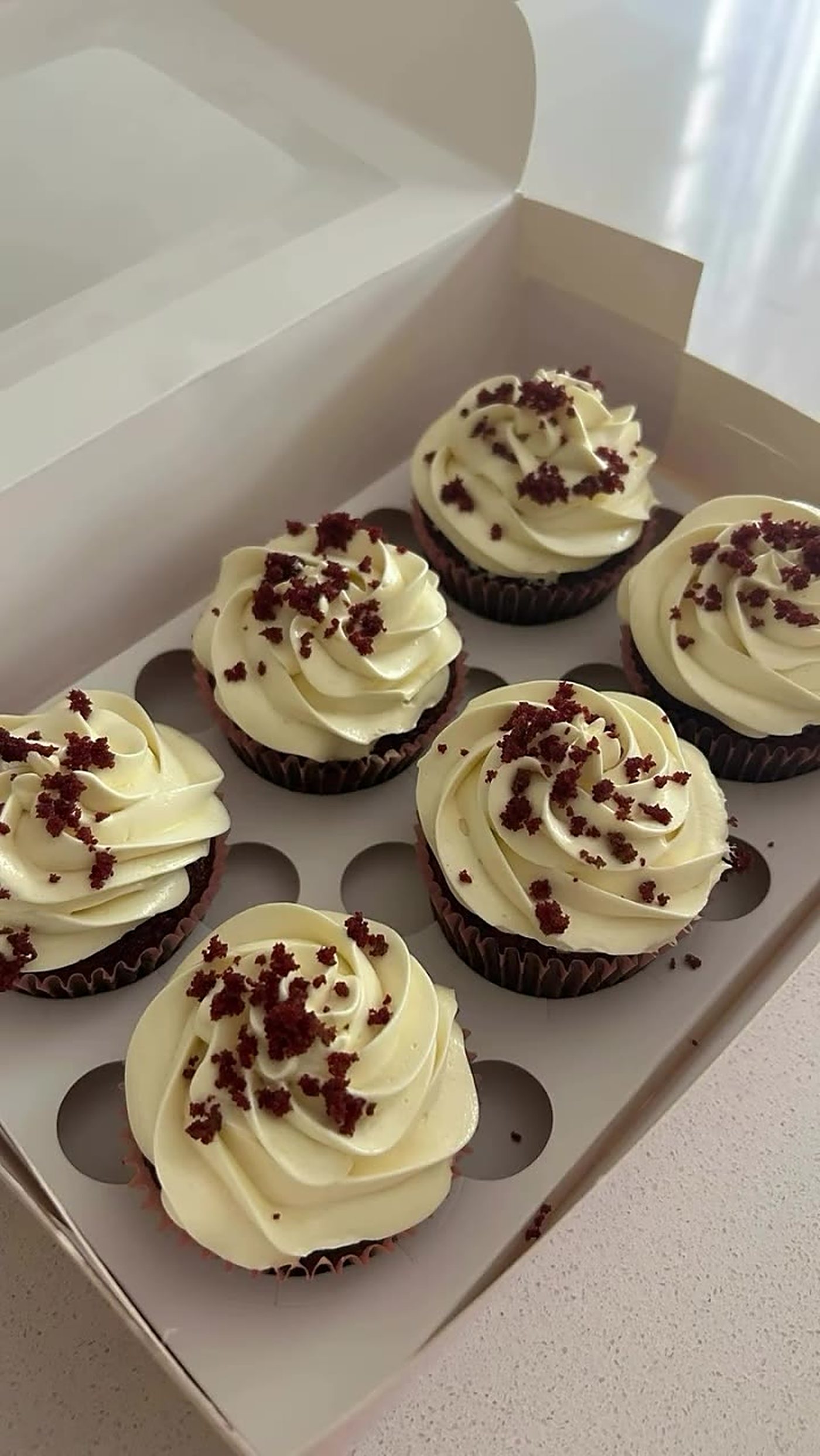 Red velvet cupcakes with cream frosting