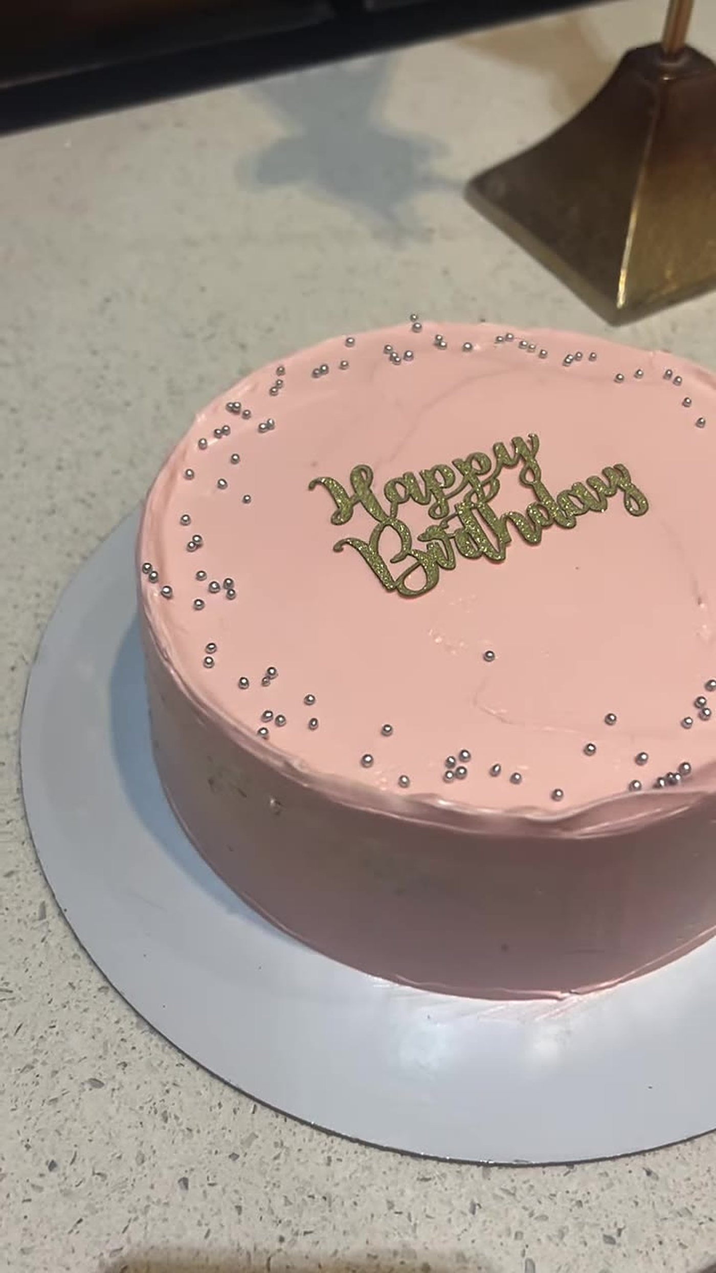 Pink birthday cake with silver sprinkles